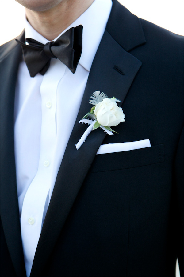 photo by New York City based wedding photographer Karen Hill - detail menswear image - black bow tie with white rose boutonniere